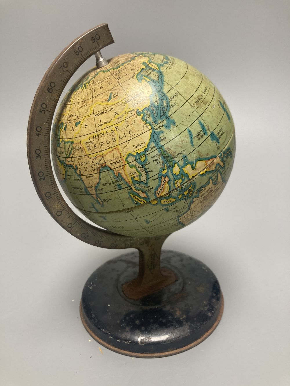 A Reliable Series lithographed tinplate revolving globe, 20cm, and two graphic globes,on ebonised wood bases, one by Philips
